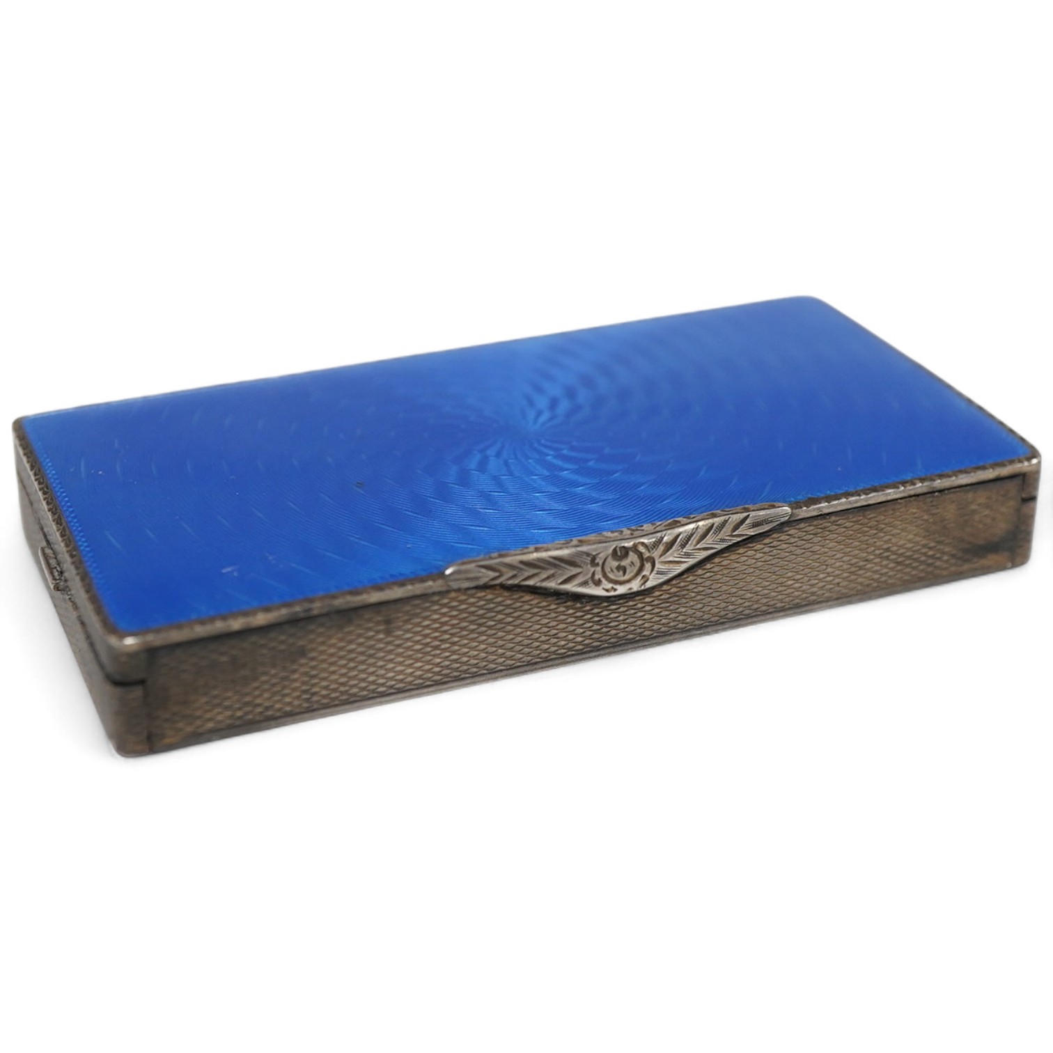 An early to mid 20th century engine turned silver and blue guilloche enamelled rectangular compact (a.f.), London import marks, 79mm.